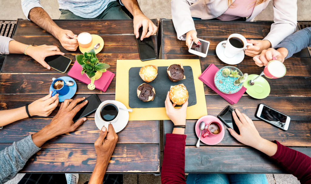 people creating connections and community in person or on the phone over coffee.